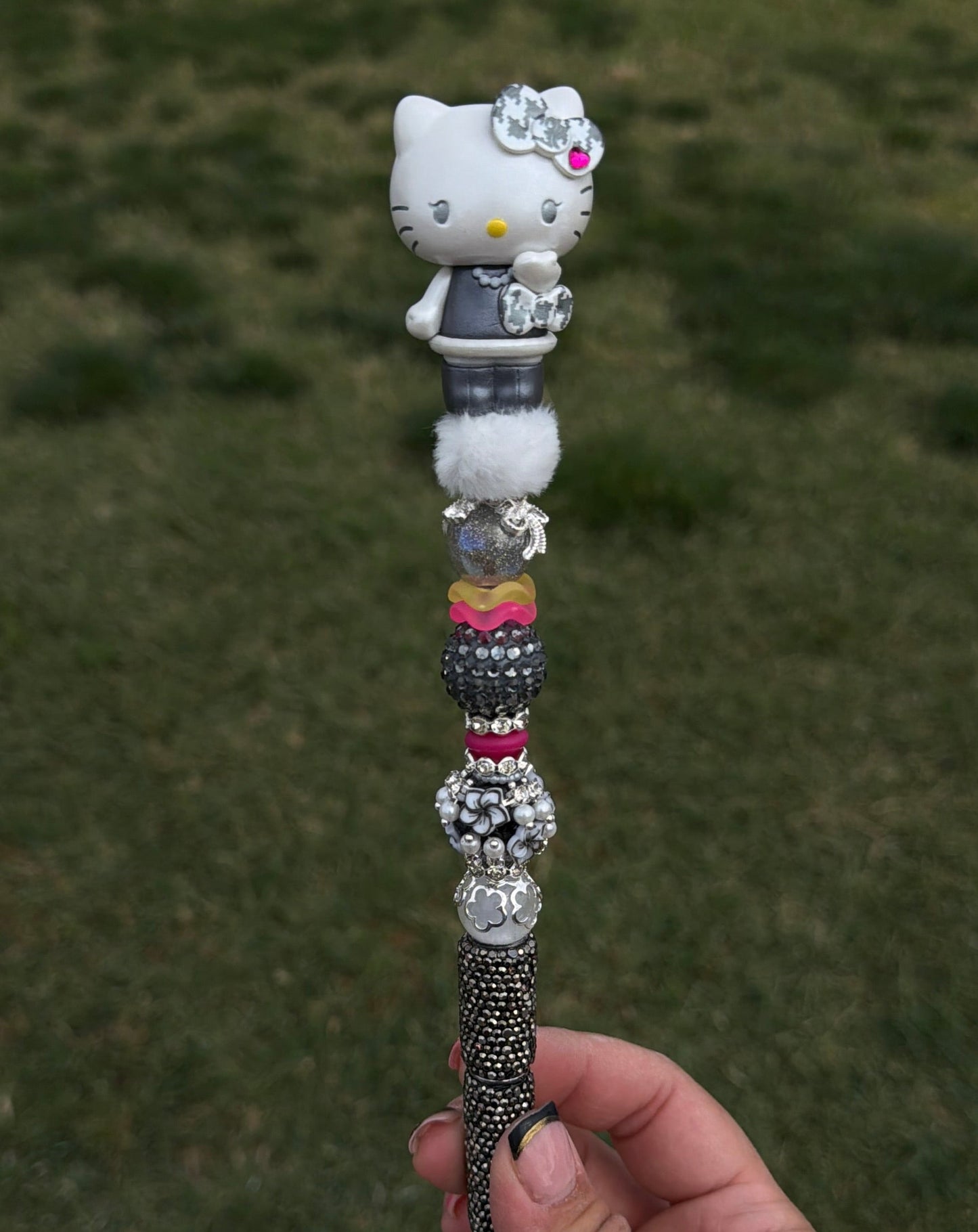 HK checkered silver rhinestone pen